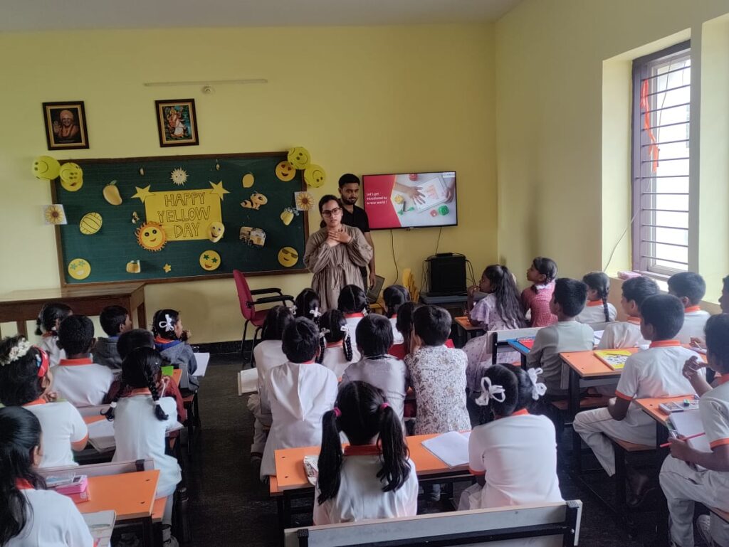 Teacher addressing students in a decorated classroom